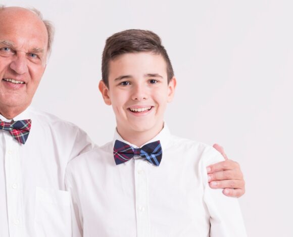 Grandfather and grandson in bow ties