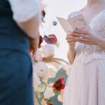 The bride reads a wedding speech to groom. Beautiful moment from a wedding ceremony in nature.