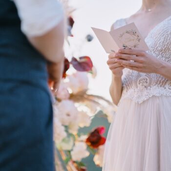 The bride reads a wedding speech to groom. Beautiful moment from a wedding ceremony in nature.