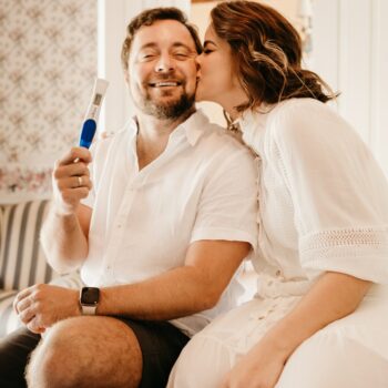 Photo by Jonathan Borba man in white button up shirt sitting beside woman in white shirt