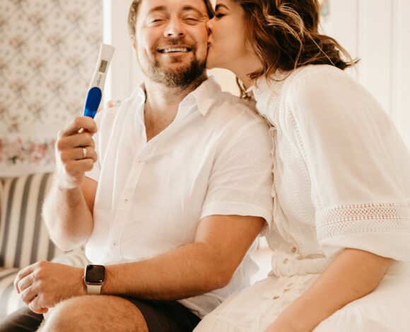 Photo by Jonathan Borba man in white button up shirt sitting beside woman in white shirt